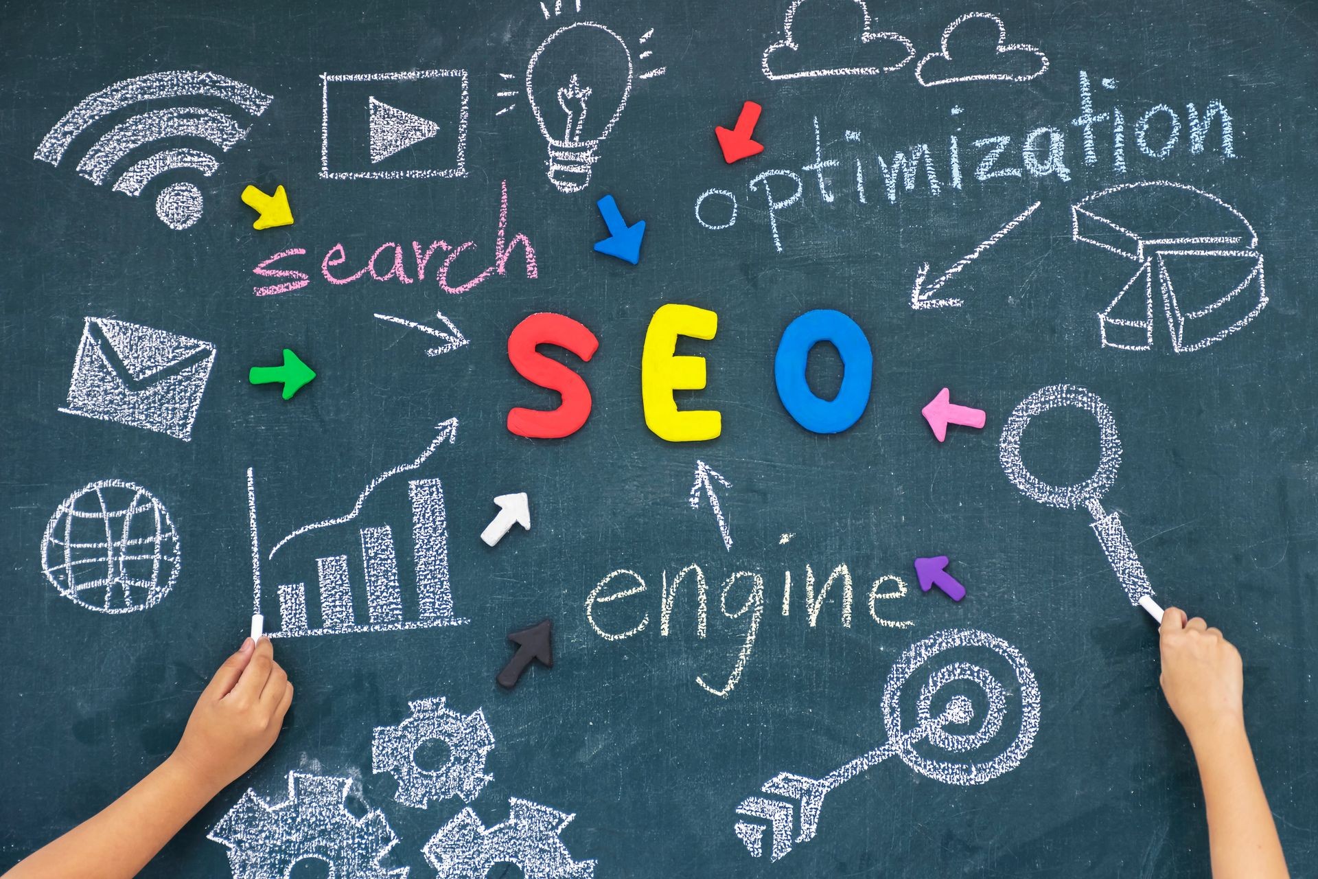 SEO, Search Engine Optimization ranking concept, with arrows pointing to alphabets abbreviation SEO at the center of cement wall chalkboard and Computer Symbols,the idea of promote traffic to website.